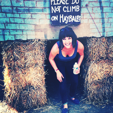 Right before Rosie climbed on the haybales...